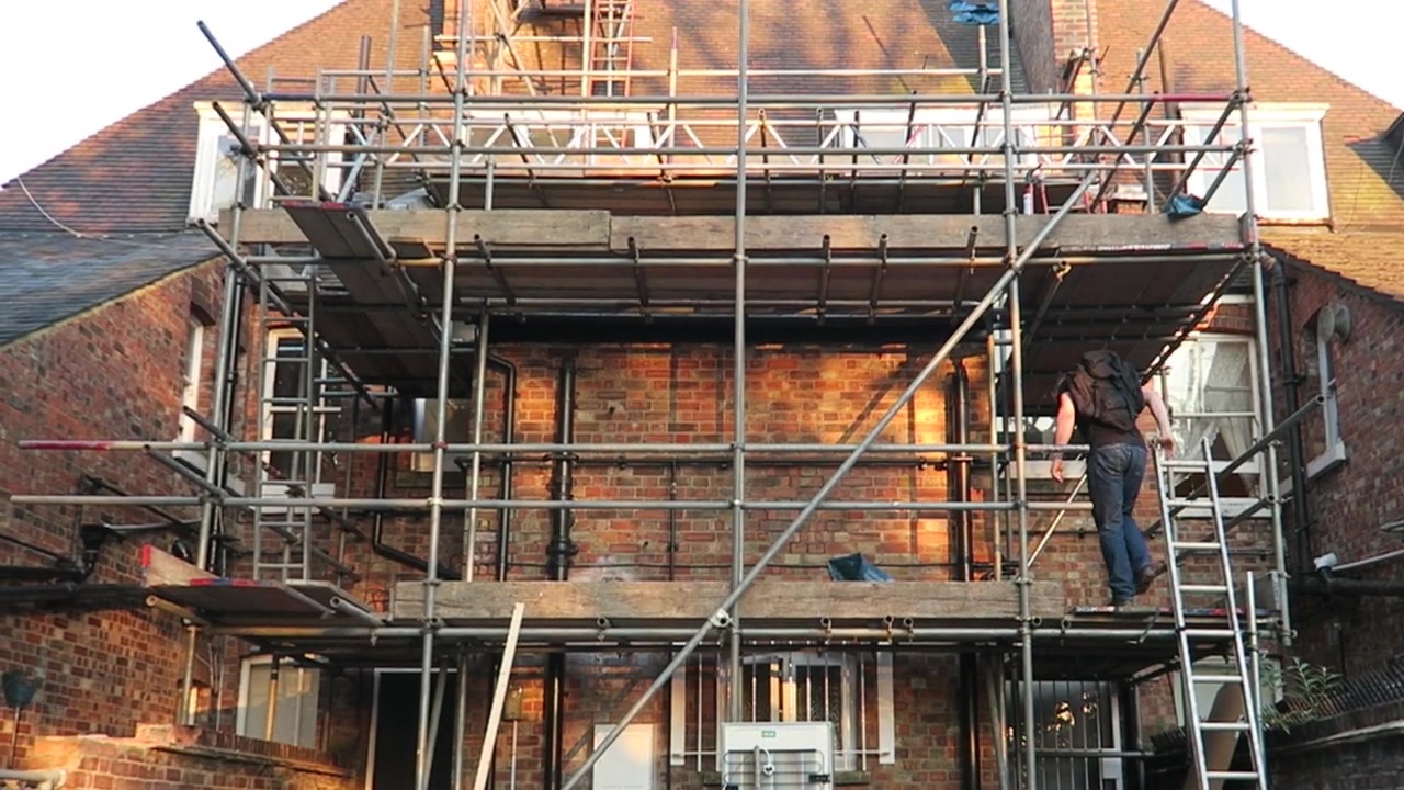 Scaffolding around the brick building during renovation work in 2015.