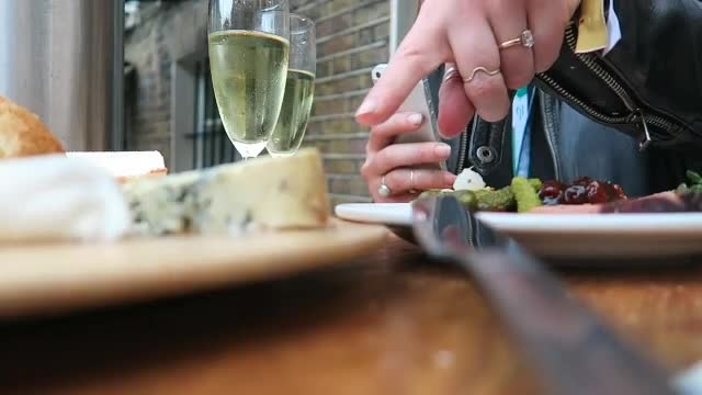 Cheese, bread, pickles and sparkling wine at our terrace table.