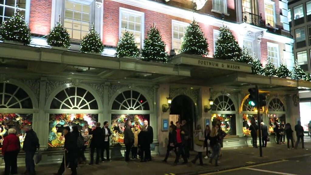 Fortnum & Mason’s illuminated Piccadilly storefront with Christmas garlands