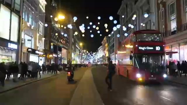 Oxford Street Christmas lights above a red bus in 2015