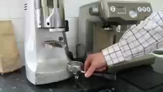 Preparing espresso with a grinder and coffee machine at home