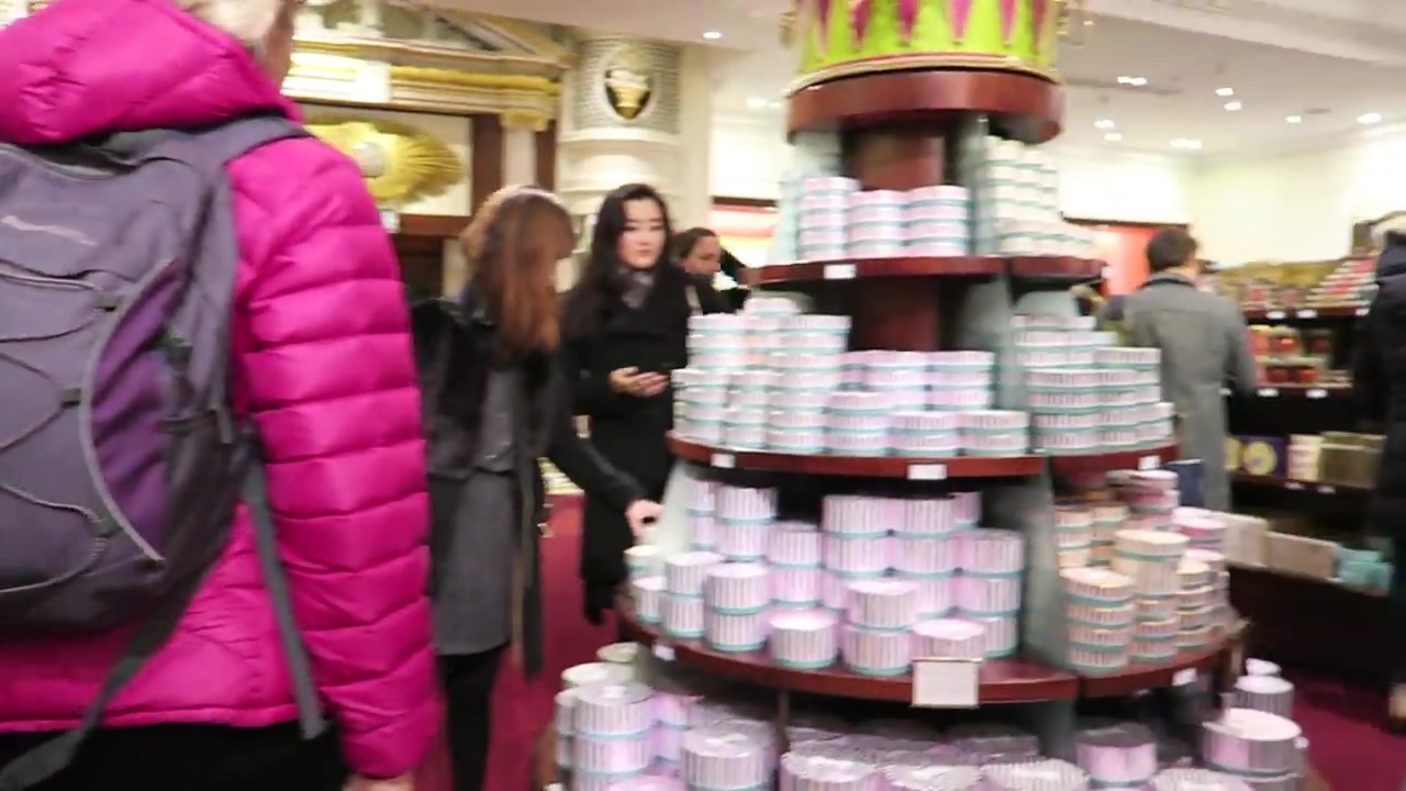 Stacked confectionery tins and displays on the shop floor