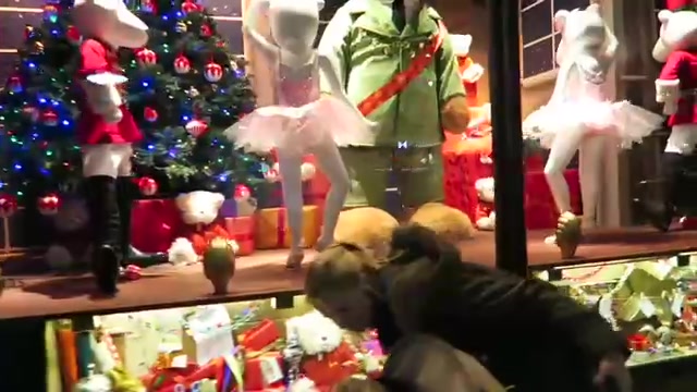 Christmas tree and dressed figures in a Harrods window
