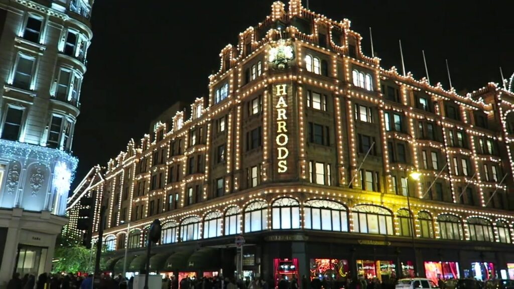 Harrods illuminated at night in the London Christmas montage