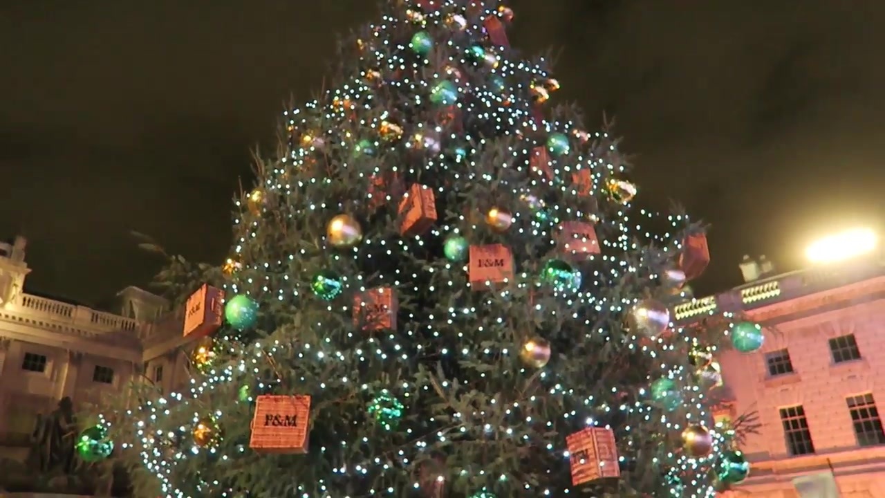 The decorated Christmas tree at Somerset House with lights and Fortnum & Mason ornaments.