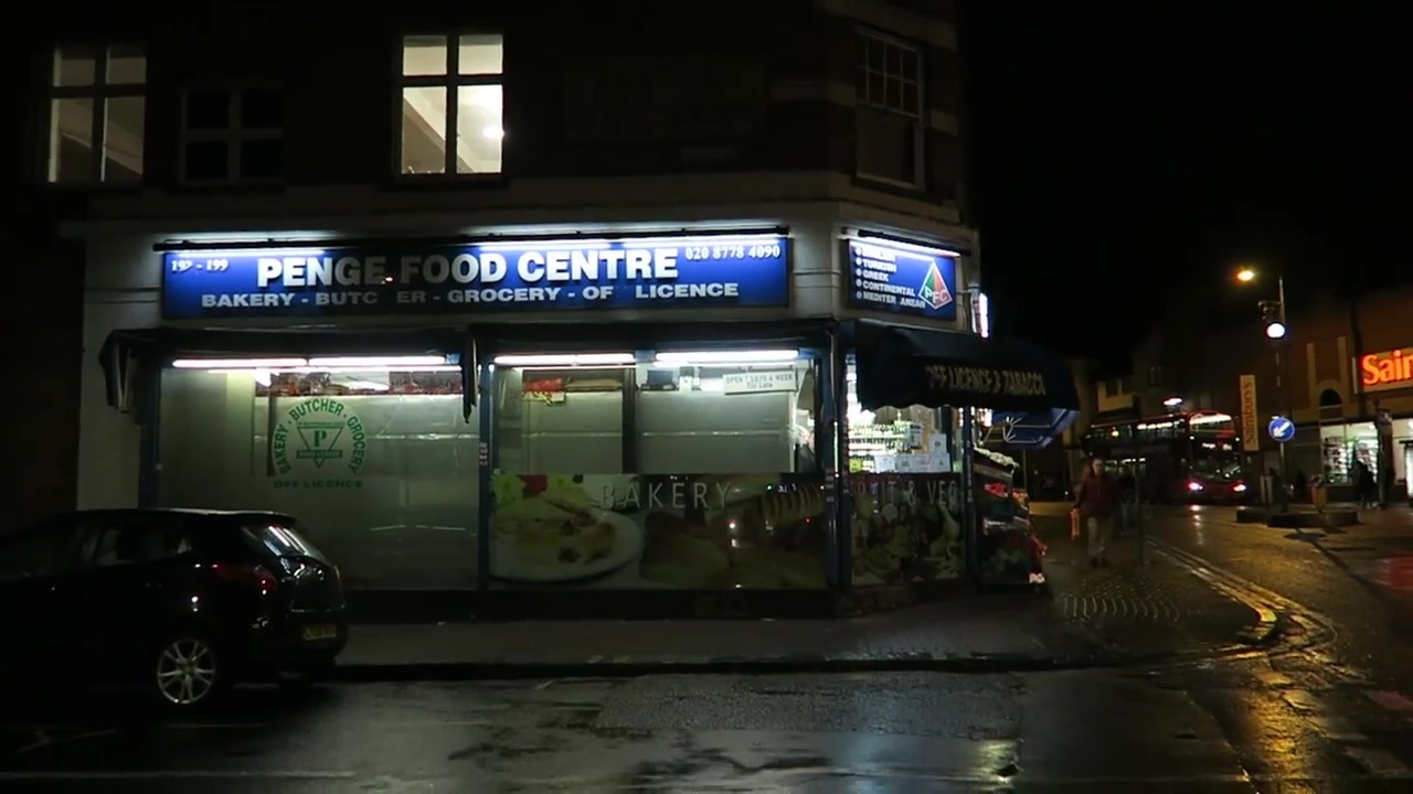 Penge Food Centre storefront illuminated after dark