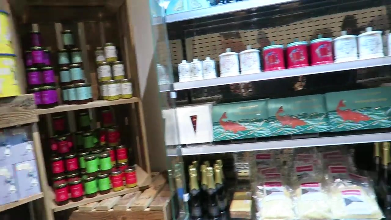 Shelves of bottles and packaged gifts in the Fortnum & Mason Christmas pop-up shop.