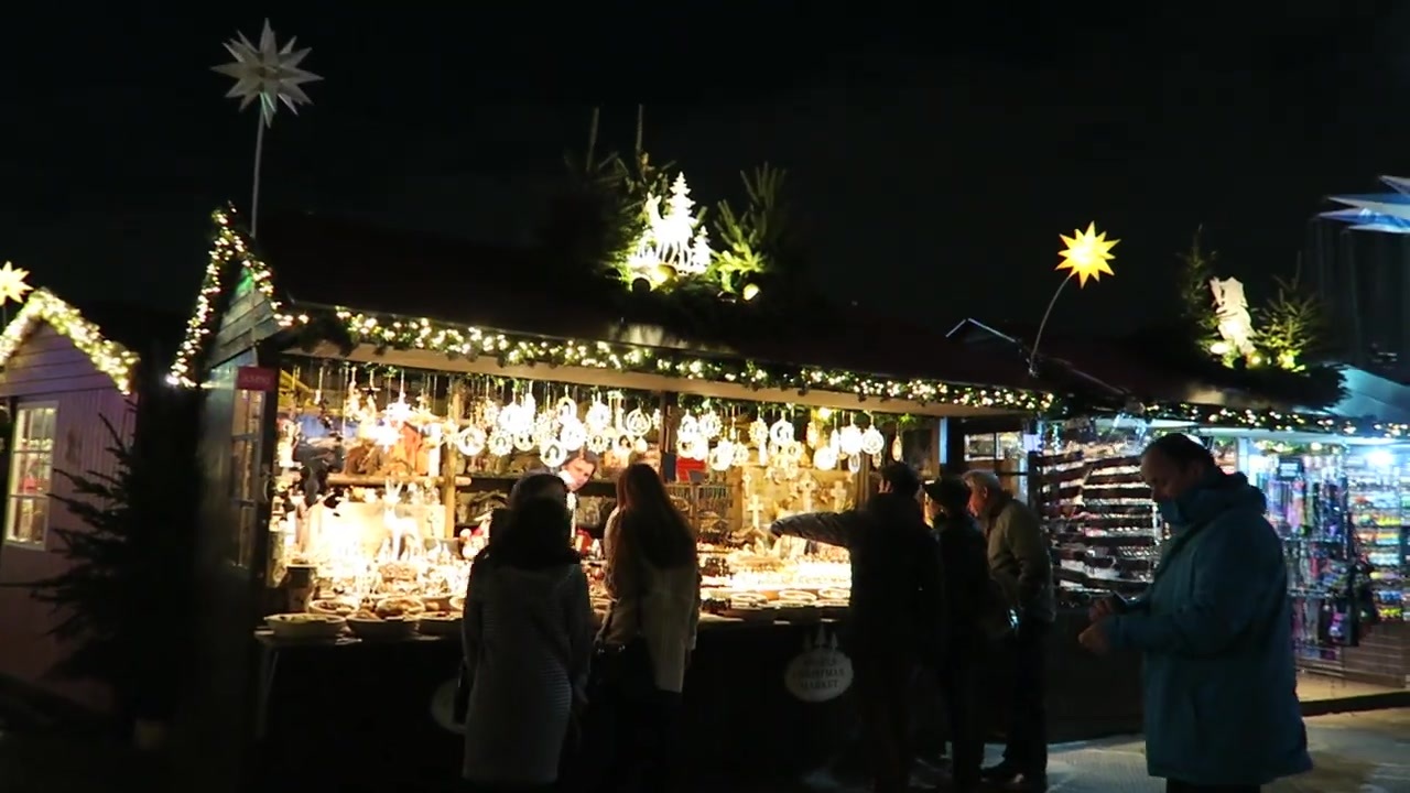 Christmas market stalls decorated with lights and star ornaments