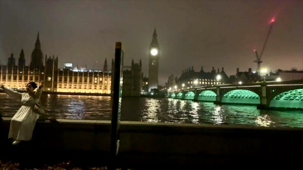 Illuminated Houses of Parliament and Westminster seen across the River Thames at night