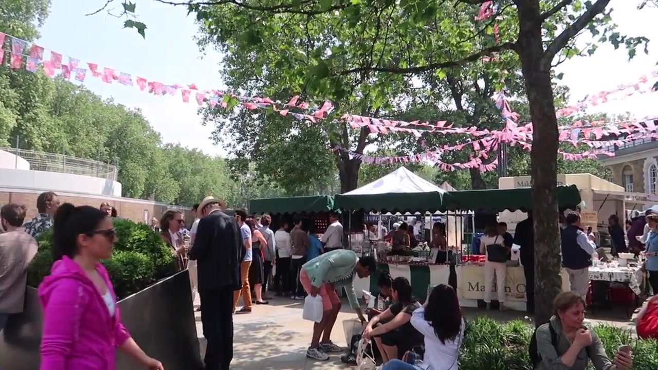 Partridges fine food shop and market crowd in Duke of York Square, Chelsea