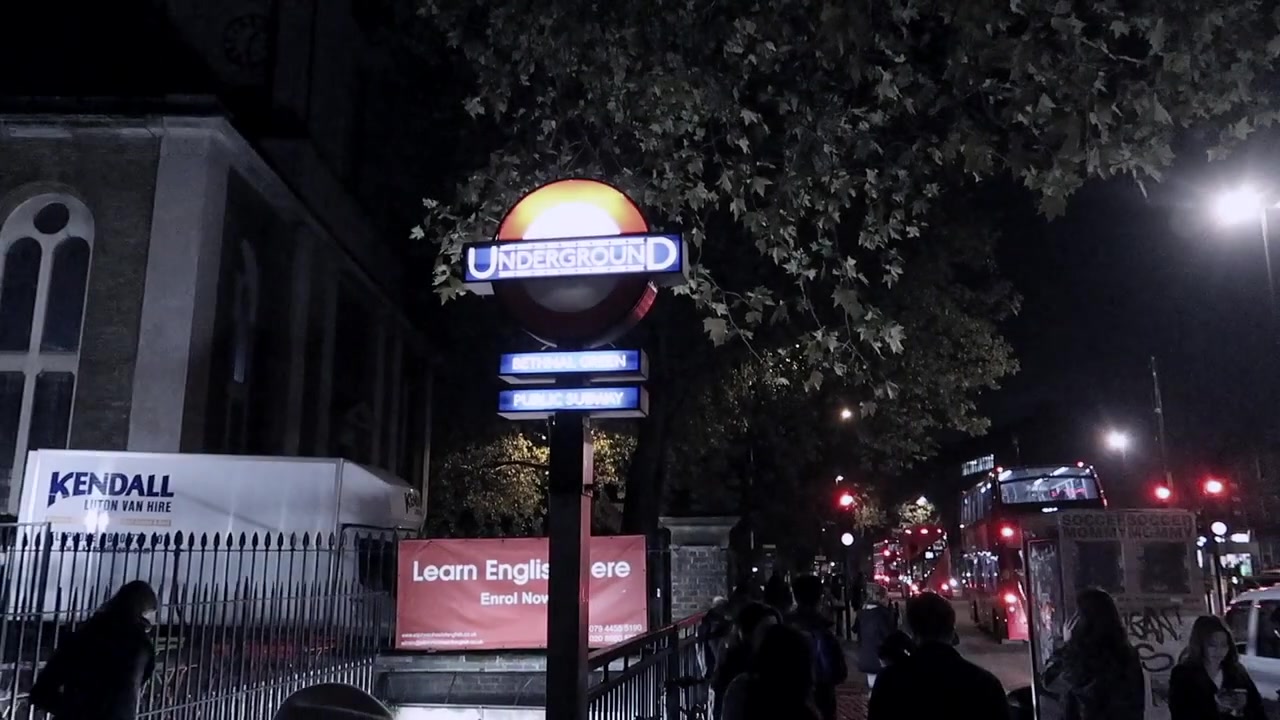 Bethnal Green Underground station at night as crowds head towards Victoria Park