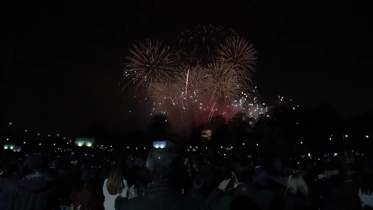 Golden fireworks above spectators watching the Victoria Park Guy Fawkes display