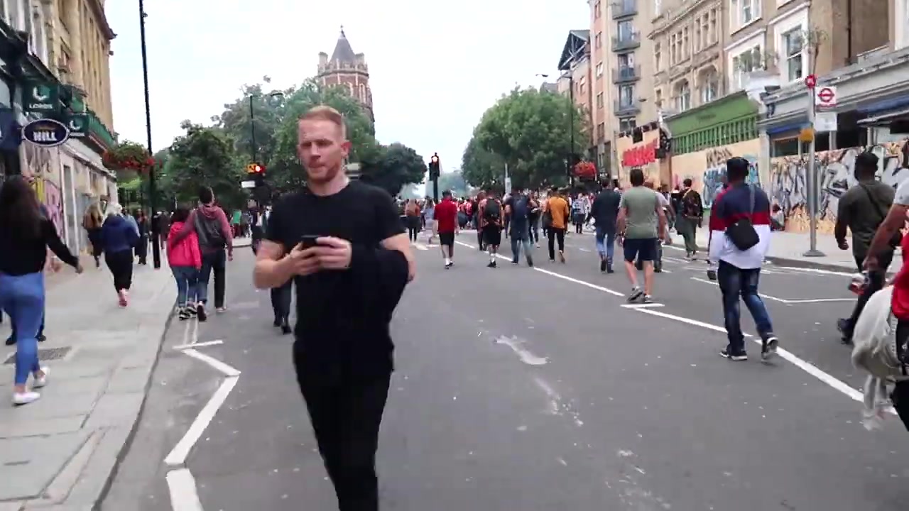Barry Roberts walking through Notting Hill Carnival during the Monday parade in August 2018
