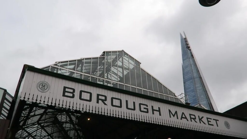 The Borough Market sign with the Shard rising behind it in 2017