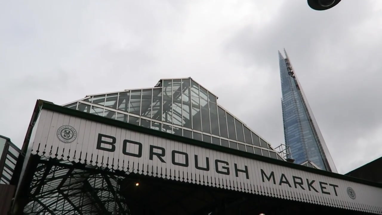 The Borough Market sign with the Shard rising behind it in 2017