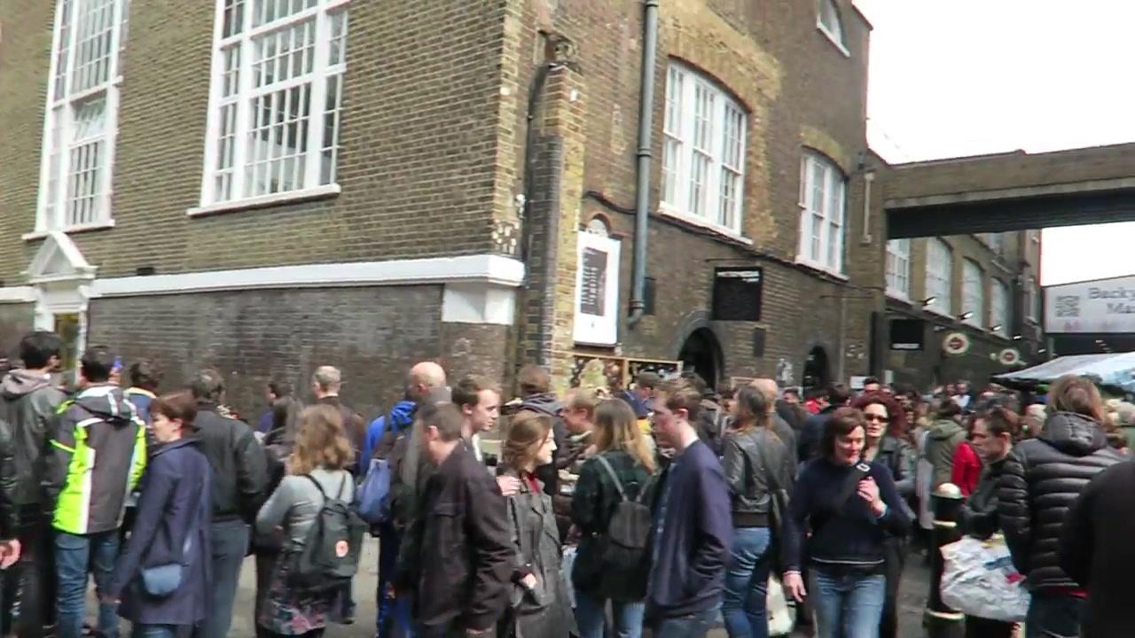 Sunday crowds outside the market buildings on Brick Lane in 2016