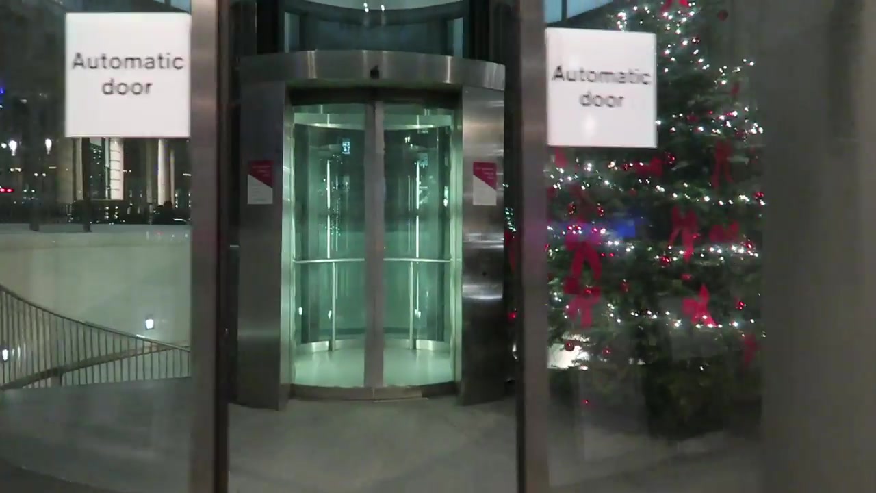 Glass lift entrance leading down to Café in the Crypt beside Trafalgar Square