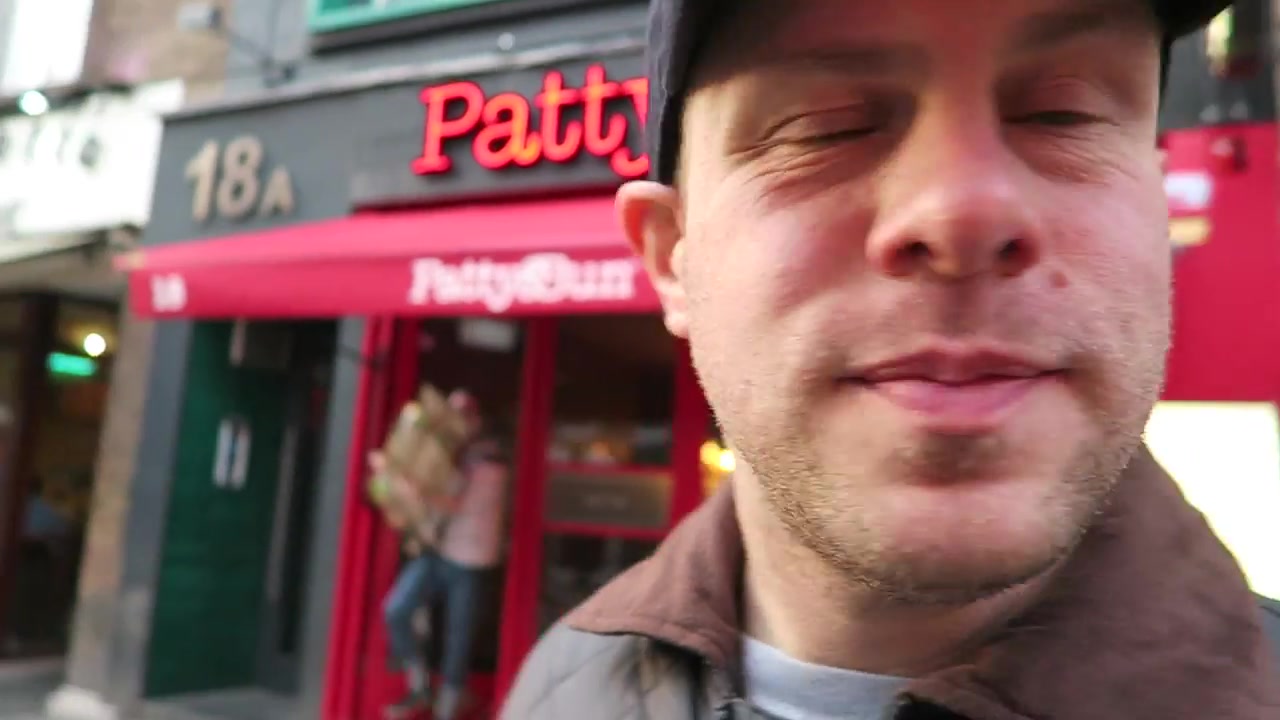 Barry outside the red Patty & Bun restaurant in Soho in 2016