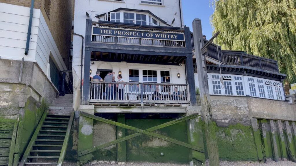 The Prospect of Whitby riverside frontage viewed from the Thames foreshore at low tide.