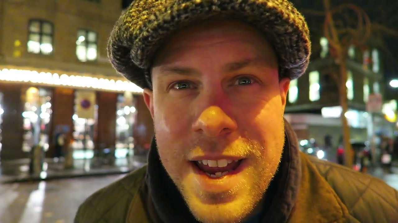 Barry Roberts outside Spitalfields Market on a wet winter evening before visiting Poppies.
