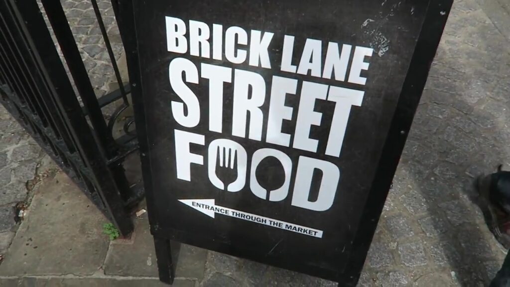 Brick Lane Street Food market sign in East London