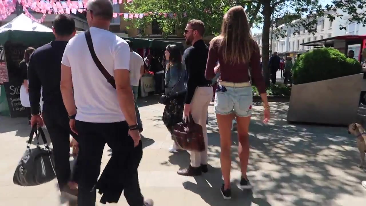Visitors walking into Duke of York Square towards the Saturday food market