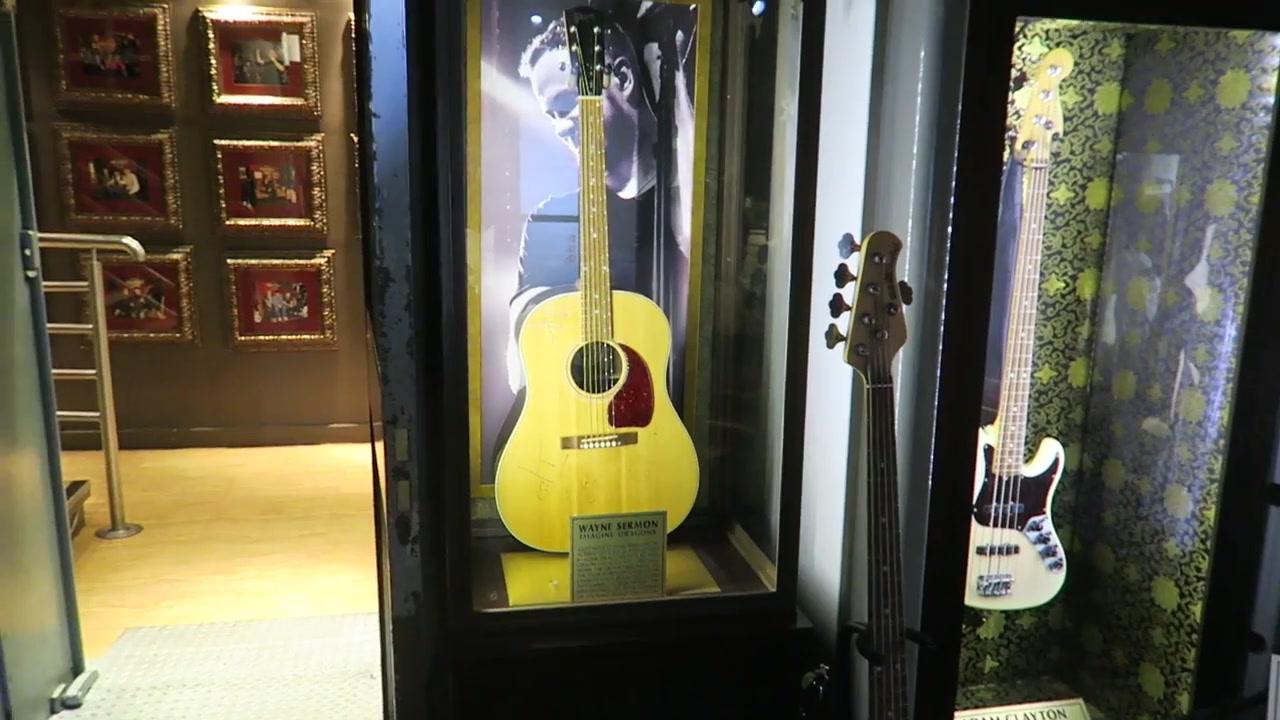 Guitars and framed rock memorabilia displayed inside Hard Rock Cafe London