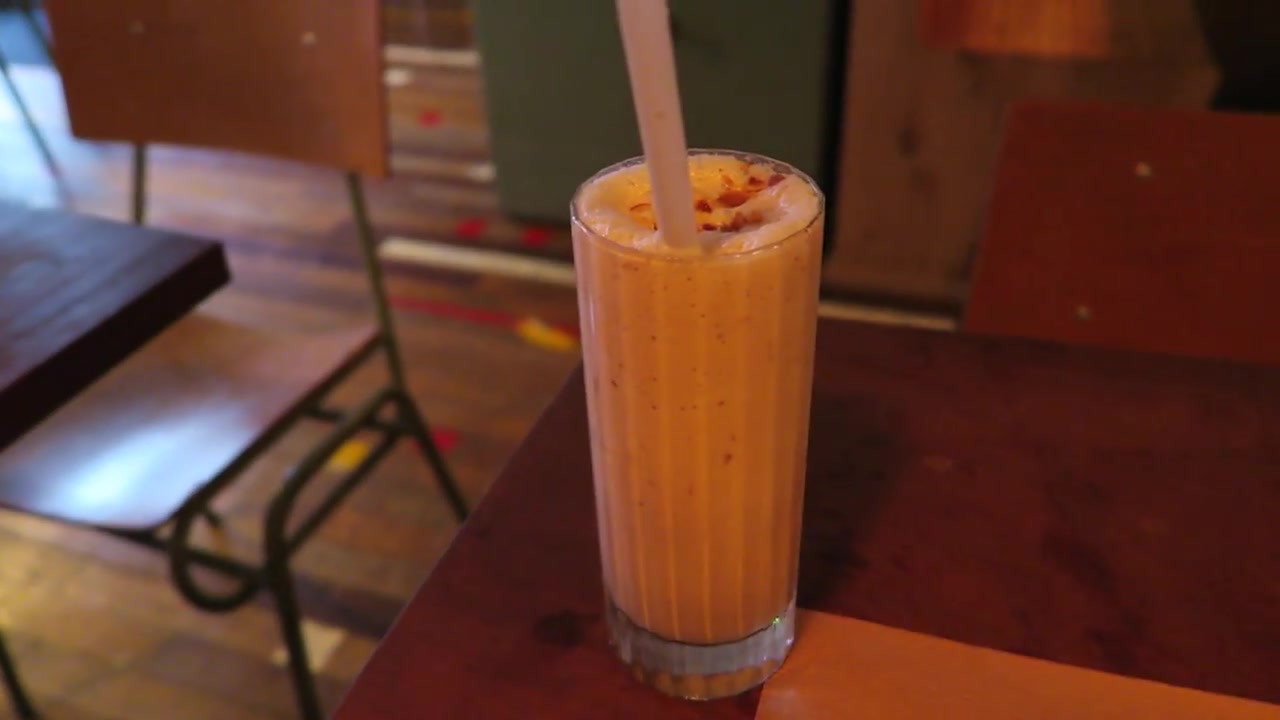 Hazelnut milkshake in a tall glass at Patty & Bun Soho