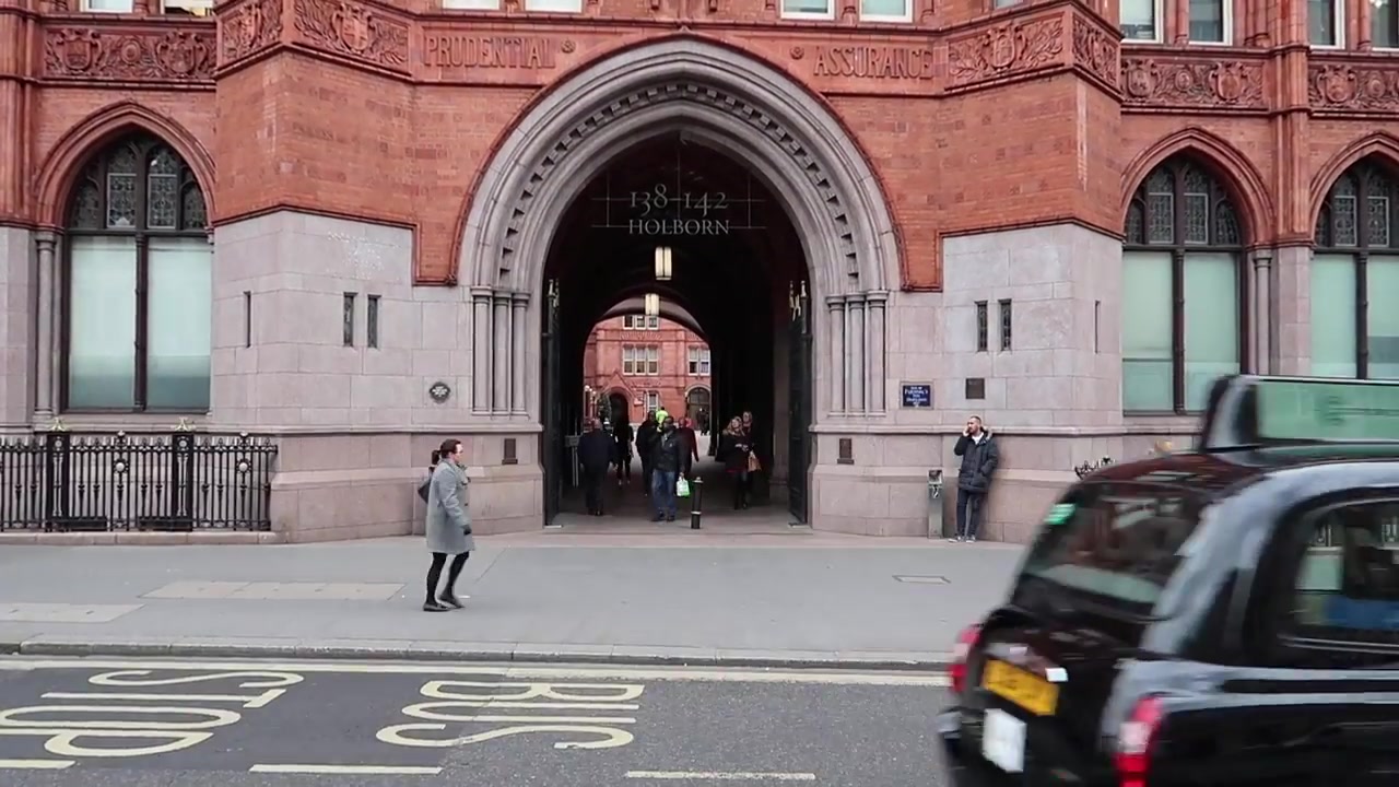 Red brick Gothic Revival entrance to Holborn Bars on High Holborn in London
