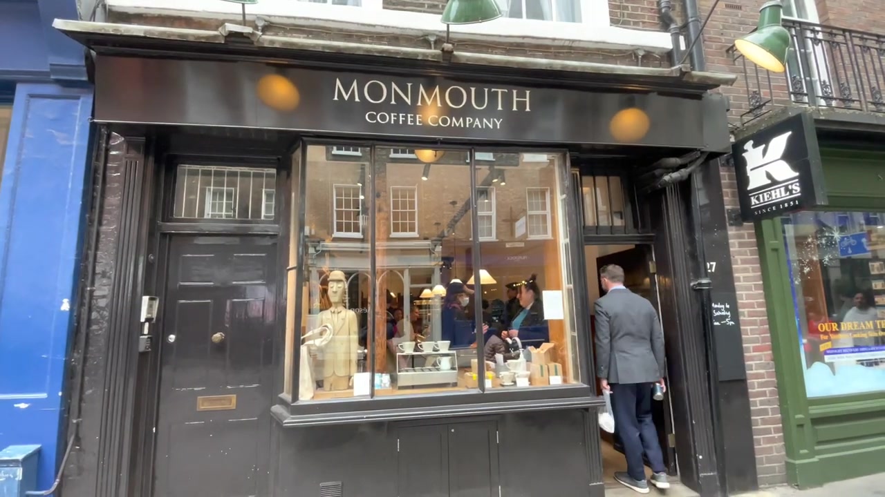 Black-painted Monmouth Coffee Company shopfront at 27 Monmouth Street in Covent Garden.