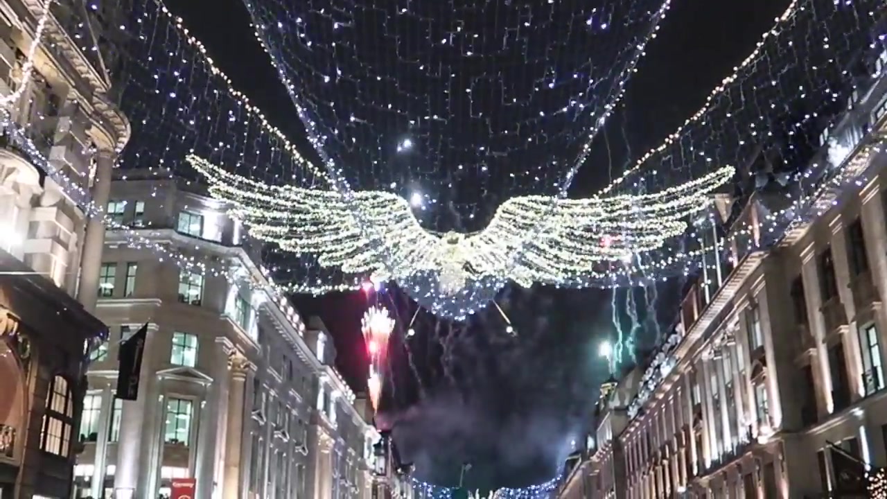 Regent Street Christmas angel lights suspended above crowds in central London