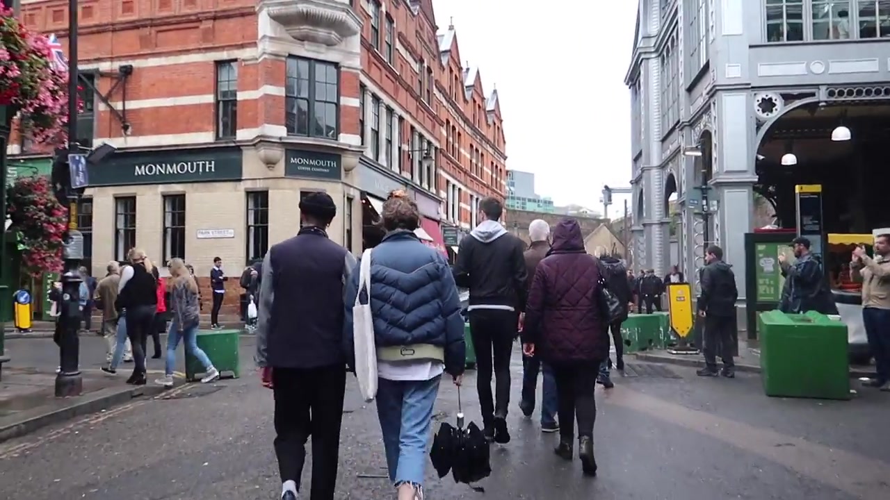 Visitors walking towards Monmouth Coffee near Borough Market and London Bridge