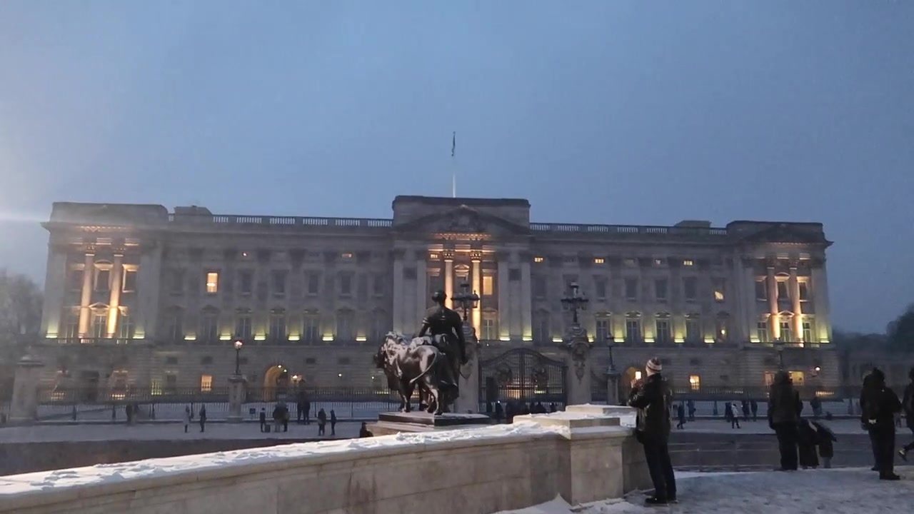 Buckingham Palace viewed across snow near the Victoria Memorial