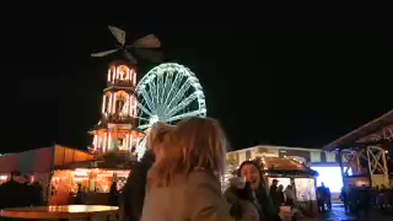 Giant Wheel illuminated above the Christmas market at Hyde Park Winter Wonderland 2015