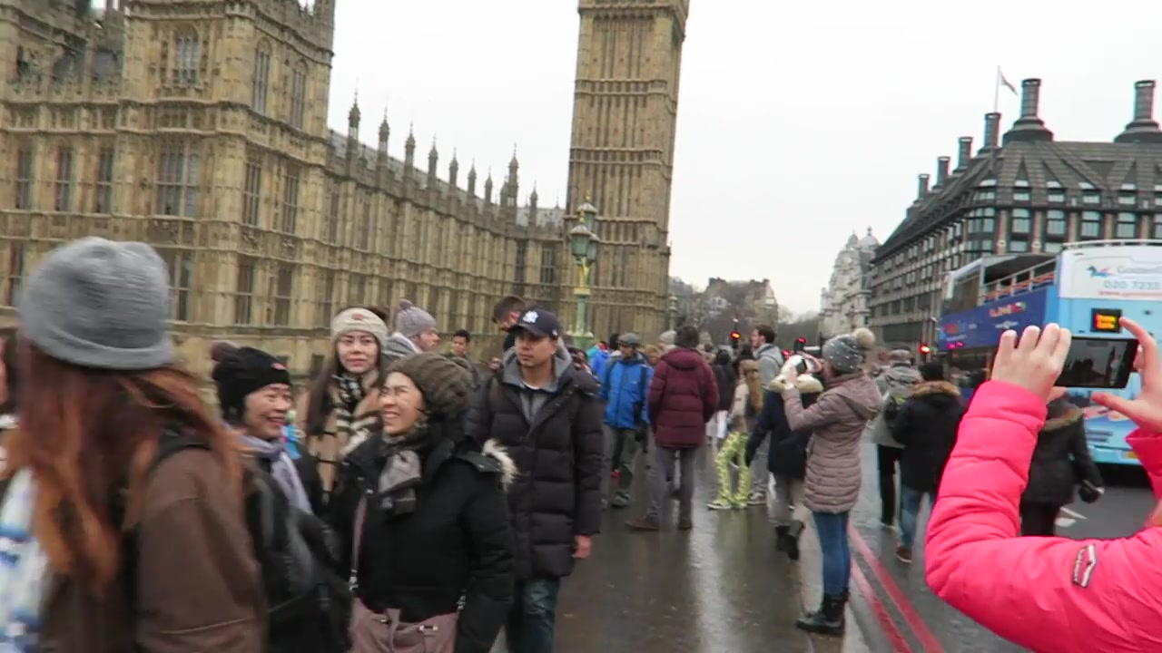 New Year’s Eve visitors beside Big Ben and the Palace of Westminster
