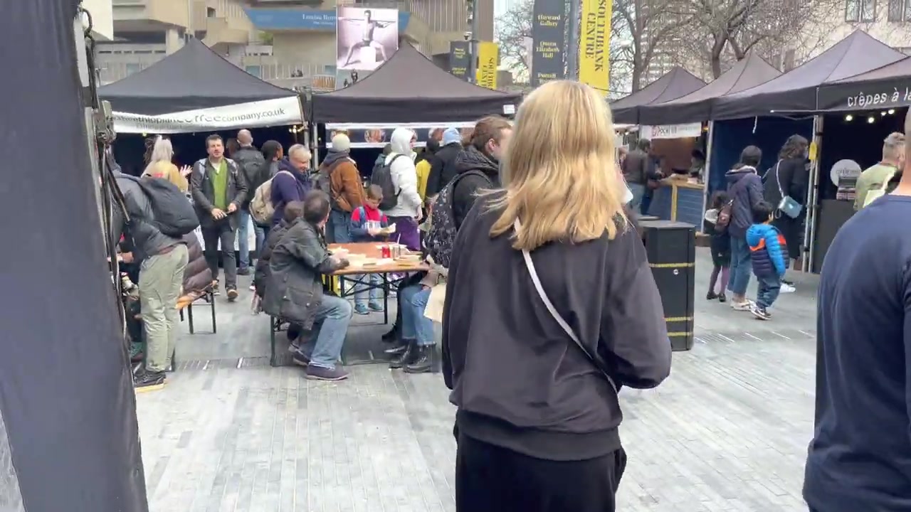 Crowds moving between food stalls at Southbank Centre Food Market in May 2022.