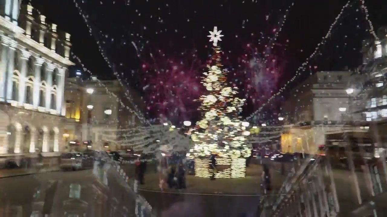 Christmas tree glowing in Trafalgar Square during a festive London evening