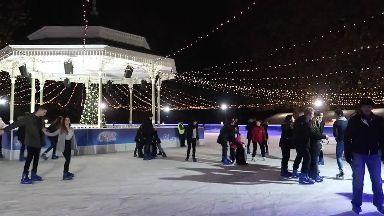 Ice skaters beneath lights around the Victorian bandstand at Hyde Park Winter Wonderland 2017