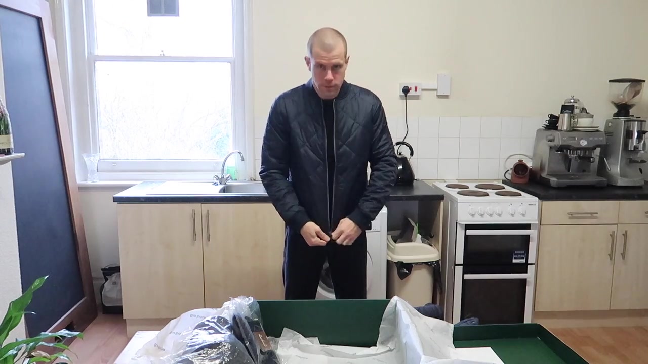 Barry Roberts wearing a navy Barbour International Steve McQueen quilted jacket during a 2018 Roberts London wardrobe film.