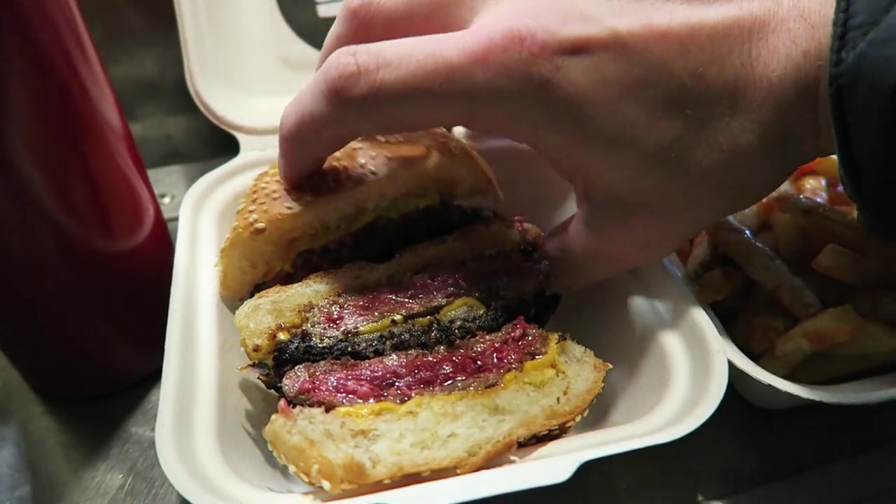 Bleecker Black double burger with black pudding beside Angry Fries