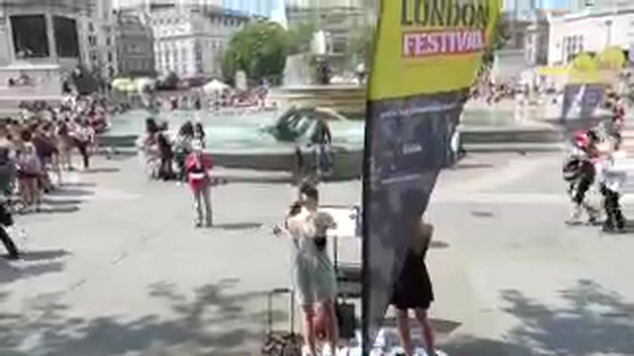 Designated performance pitch and audience at the Busk in London festival in Trafalgar Square.