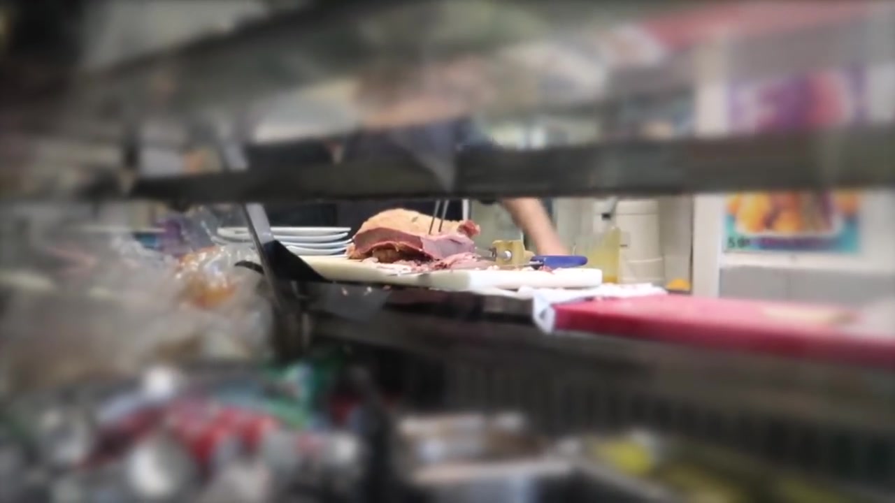 Food being prepared behind the counter at Gaby’s Deli in London