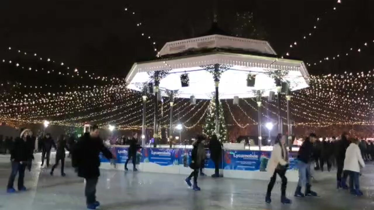 Skaters on the Hyde Park Winter Wonderland ice rink beneath white lights