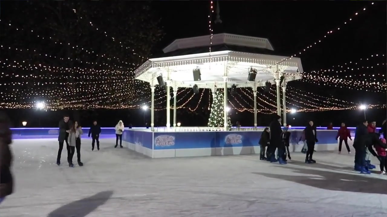 Ice skaters beneath Christmas lights in the Somerset House courtyard