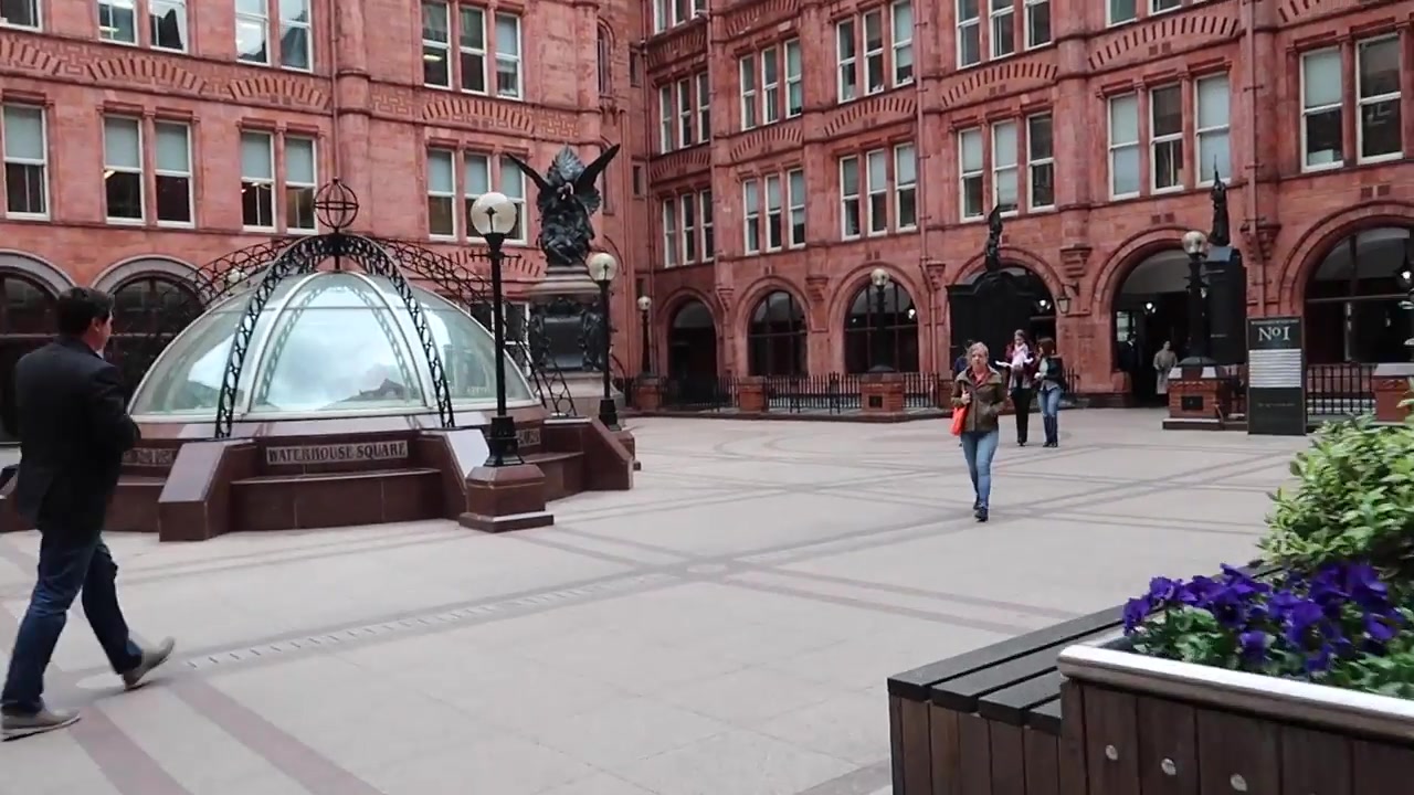 Red brick Victorian buildings surrounding Waterhouse Square at Holborn Bars