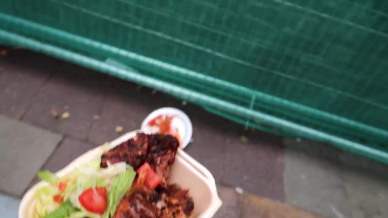 Plate of grilled meat rice salad and fried plantain served at Notting Hill Carnival 2018