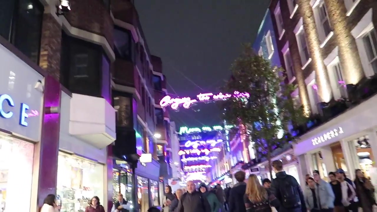 Colourful neon Christmas decorations suspended above Carnaby Street in 2018
