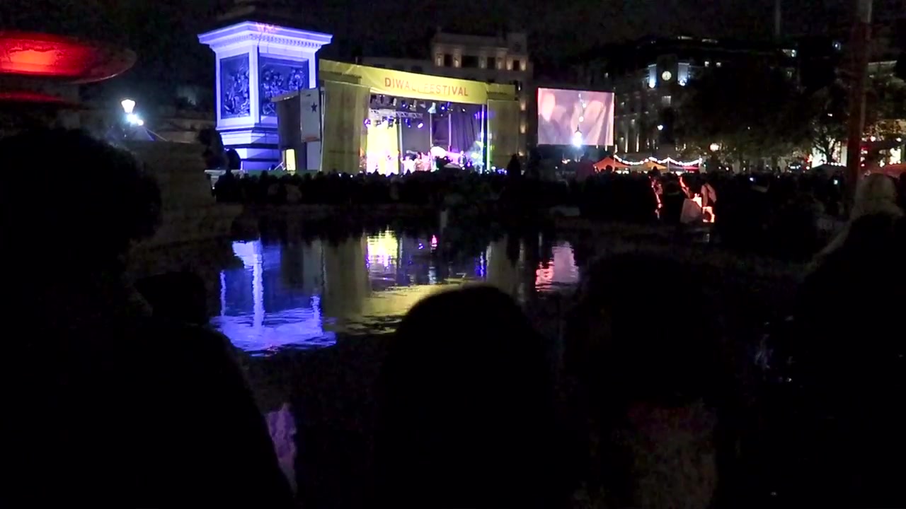 Diwali stage and lights reflected in a Trafalgar Square fountain