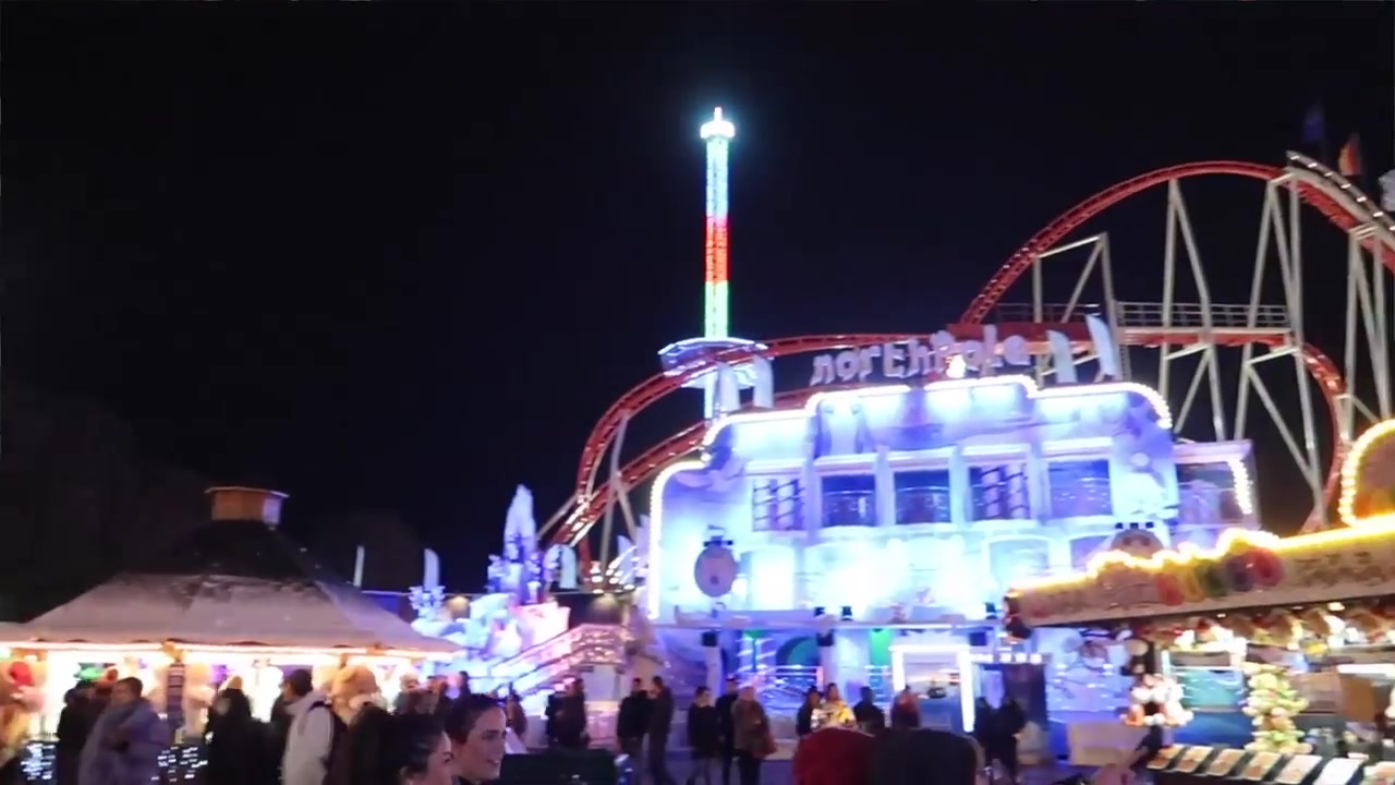 Illuminated fairground rides at Hyde Park Winter Wonderland in London