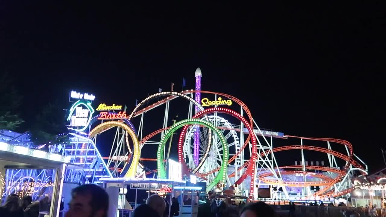 Illuminated loops of the Munich Looping roller coaster at Hyde Park Winter Wonderland 2017
